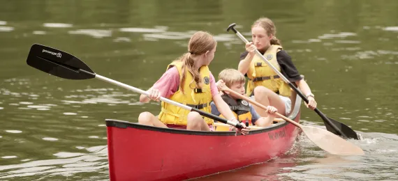 Campers canoeing on the Camp Kanata lake