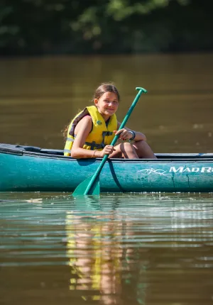 Girl canoeing at Camp Kanata