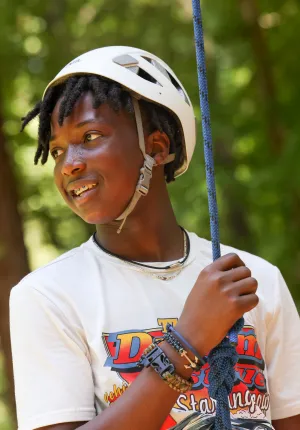 Boy with climbing rope and helmet